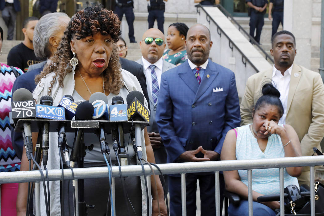 Gwen Carr, mother of chokehold victim Eric Garner, left, speaks outside the U.S. Attorney's off ...