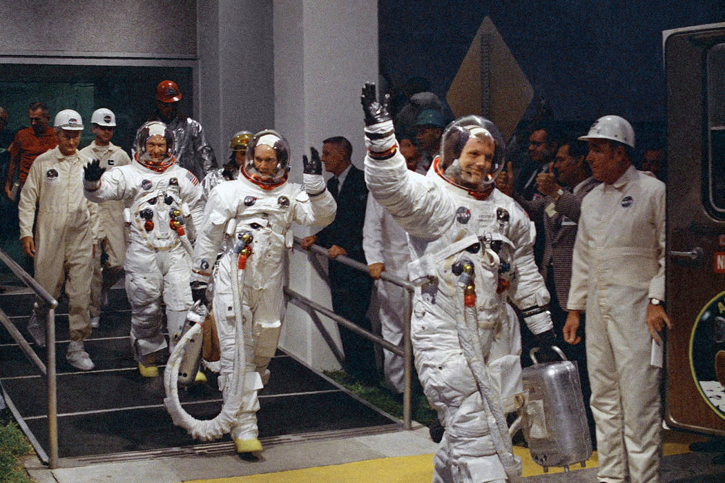 In a July 16, 1969, file photo, from right, Neil Armstrong, Michael Collins and Buzz Aldrin wal ...