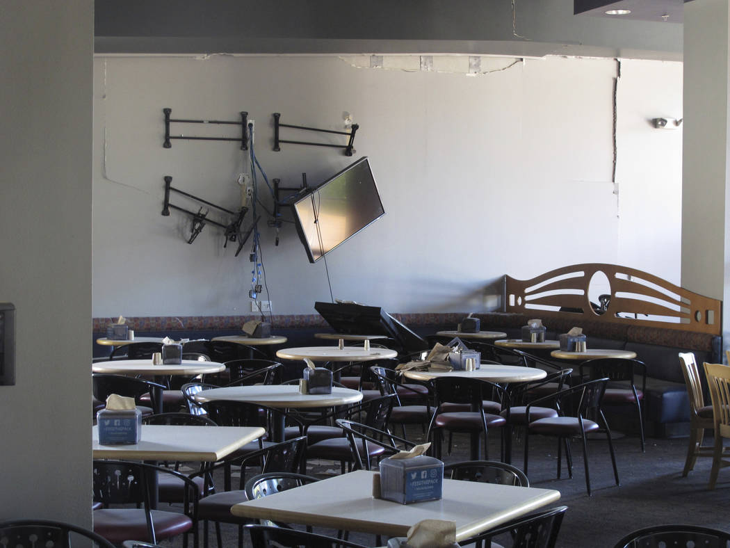 Damage is seen in the first-floor cafeteria at a University of Nevada, Reno dormitory, Thursday ...