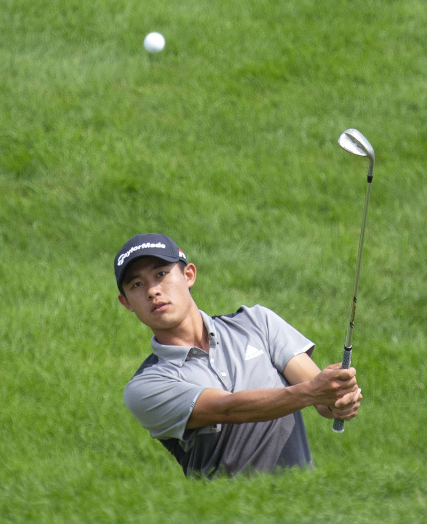Collin Morikawa hits from the rough on the 12th hole during the final round of the 3M Open golf ...