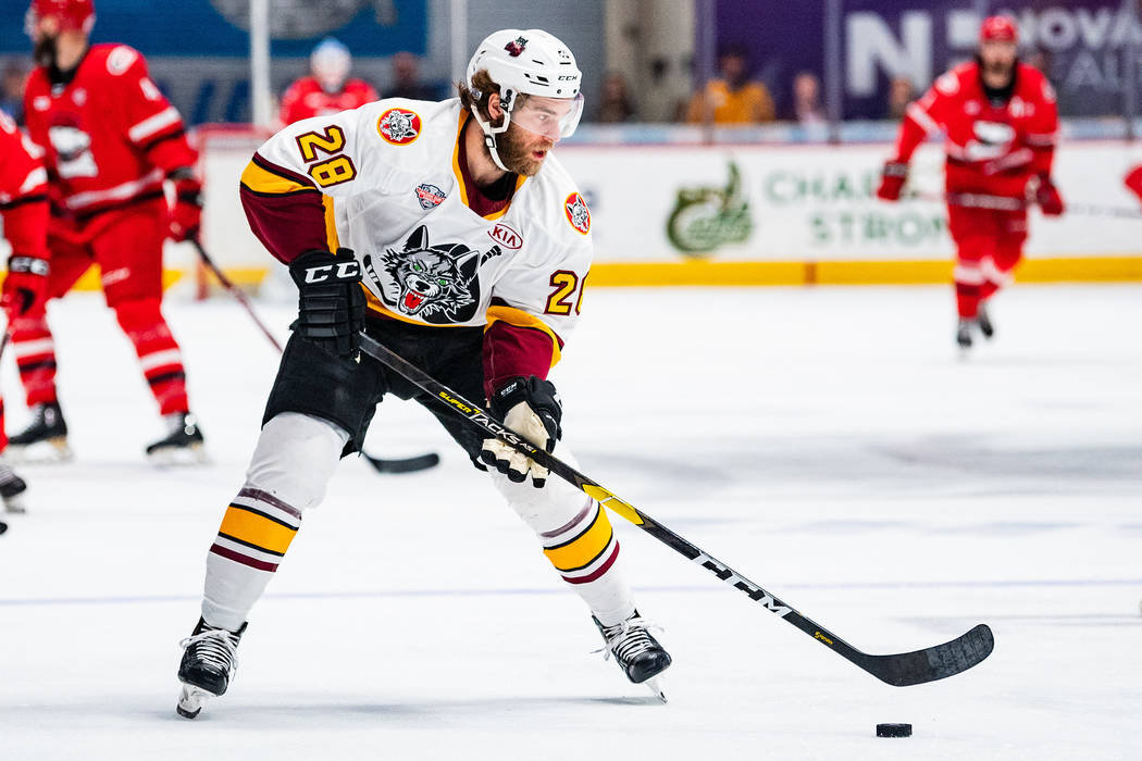 Chicago Wolves defenseman Jake Bischoff handles the puck in Game 2 of the Calder Cup Final agai ...