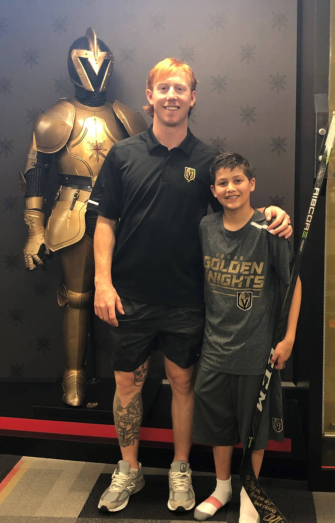 13-year-old Doron Coldwell with Golden Knights center Cody Eakin during his time with the team ...
