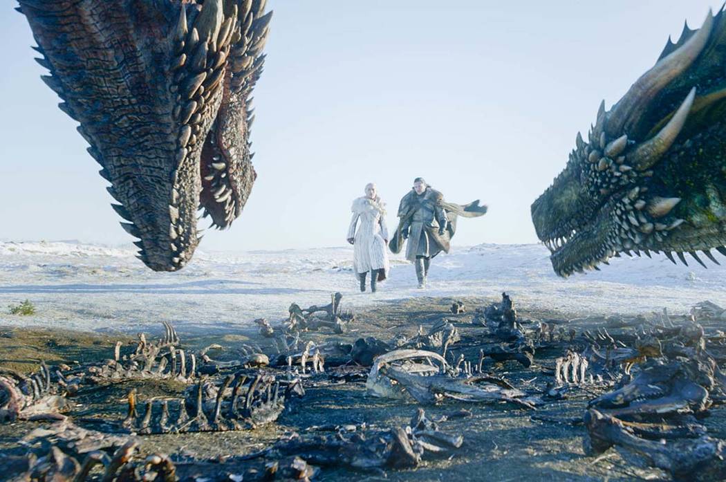 This image released by HBO shows Emilia Clarke, left, and Kit Harington in a scene from "Game ...