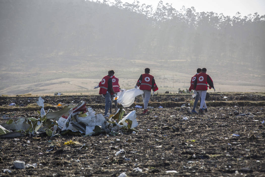 FILE - In this March 11, 2019, file photo, rescuers work at the scene of an Ethiopian Airlines ...