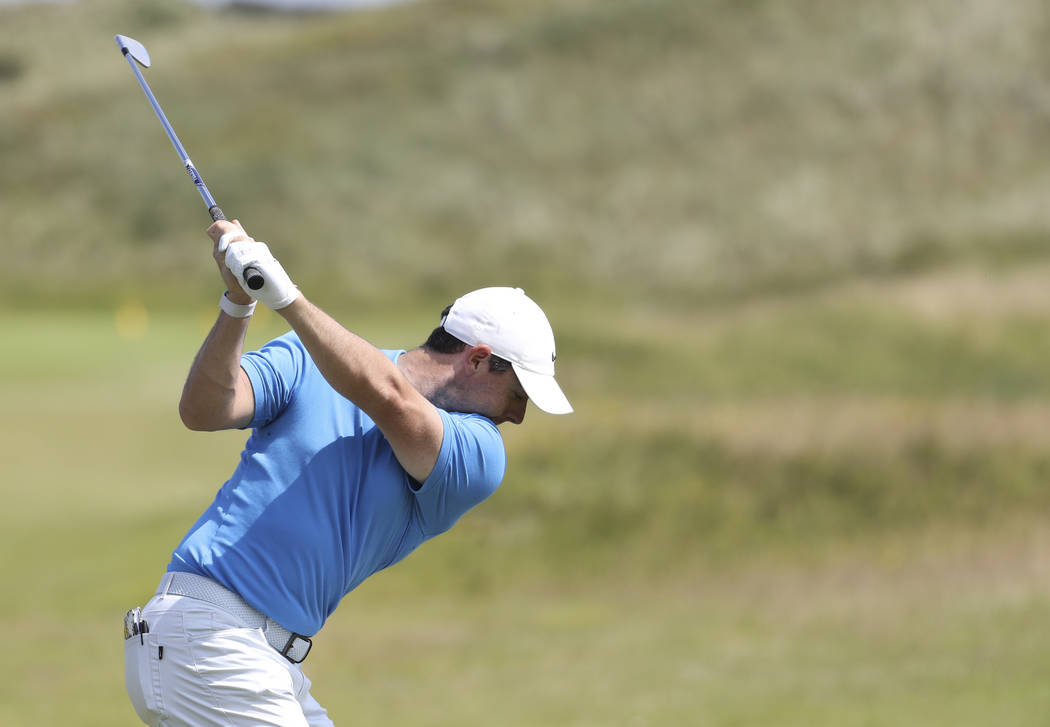Northern Ireland's Rory McIlroy hits shot on the practice range ahead of the start of the Briti ...