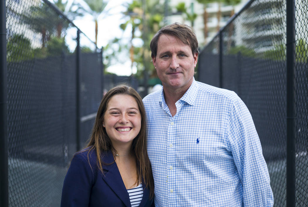 Cherrial Odell poses for a portrait with Ryan Wolfington at a tennis clinic held by the Bryan b ...