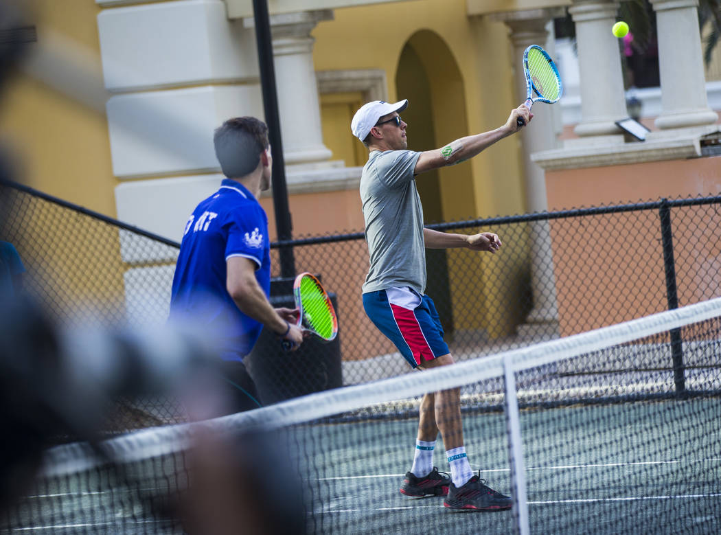 Mike Bryan helps lead a tennis clinic held at the Stirling Club at Turnberry Place in Las Vegas ...