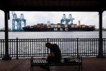 FILE - This June 18, 2019, file photo shows a container ship on the Delaware River in Philadelp ...