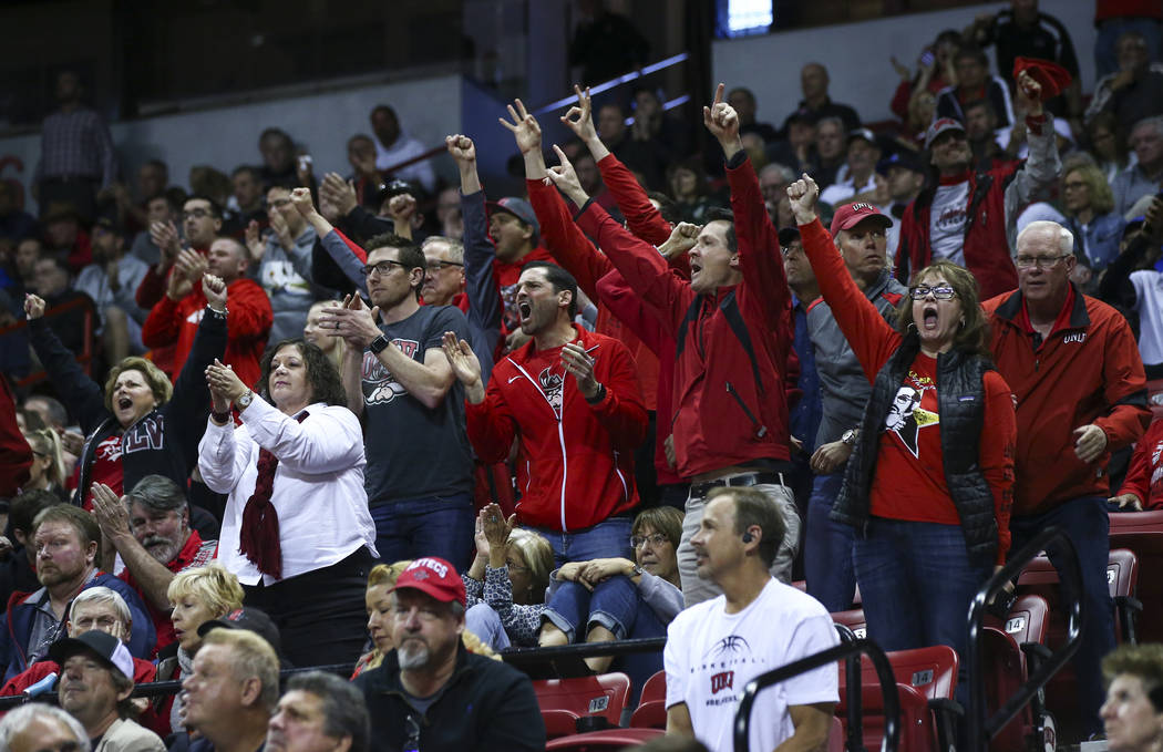 UNLV fans cheer during the second half of a quarterfinal game against San Diego State in the Mo ...