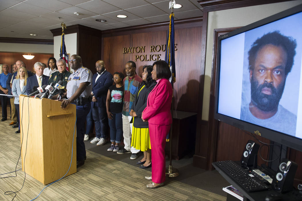 Baton Rouge area law enforcement officials including BRPD Chief Murphy Paul, at lectern, announ ...