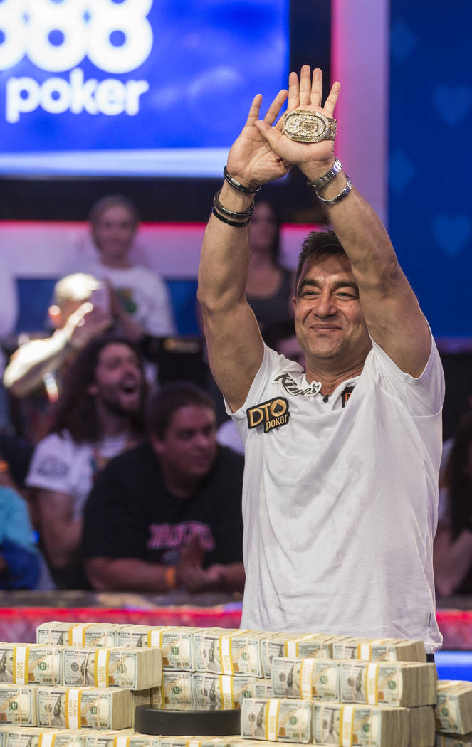 Hossein Ensan, from Germany, celebrates after winning the World Series of Poker Main Event on W ...