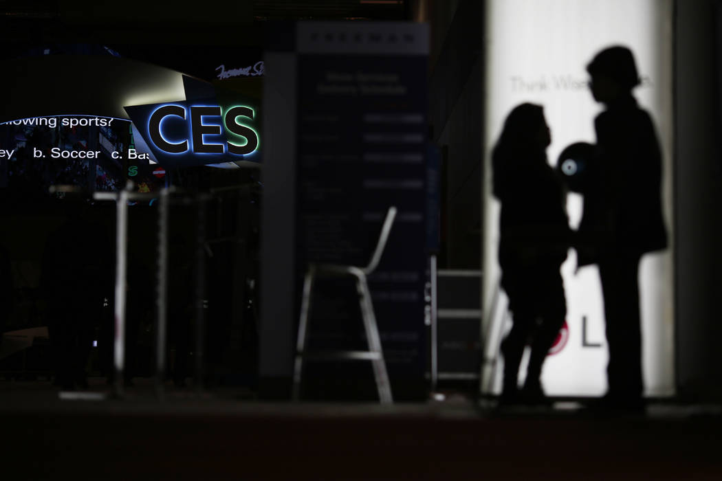 FILE - In this Jan. 5, 2019, file photo people walk around the Las Vegas Convention Center duri ...