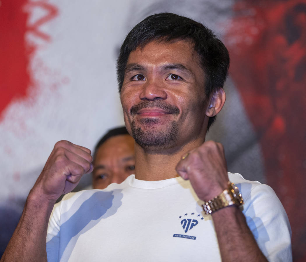 Boxer Manny Pacquiao poses for the crowd during his grand arrival to the MGM Grand on Tuesday, ...