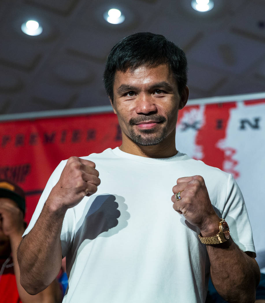 Boxer Manny Pacquiao poses for the crowd during his grand arrival to the MGM Grand on Tuesday, ...