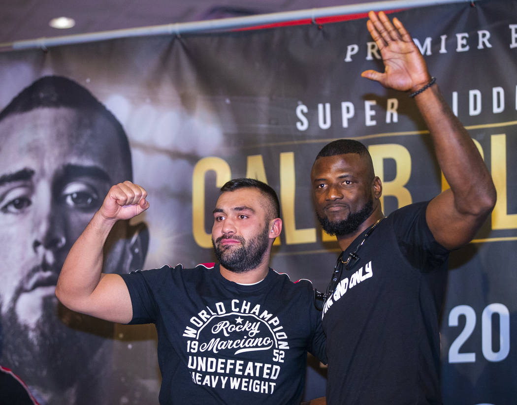 Boxers Eren Demirezen, left, joins his opponent Efe Ajaba during fighter grand arrivals at the ...