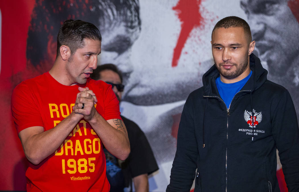 Boxer John Molina Jr., left, looks to opponent Sergey Lipinets during fighter grand arrivals at ...