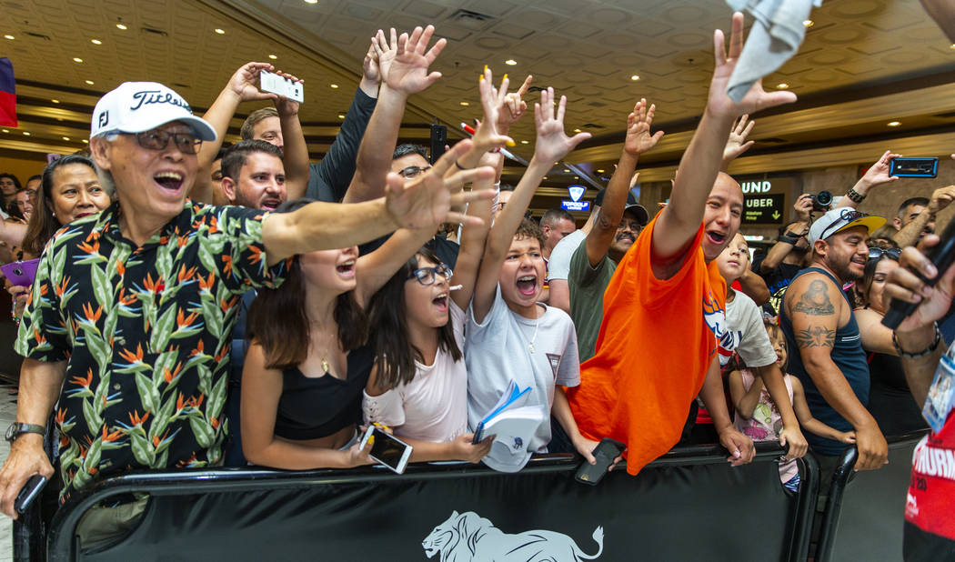 Fans go crazy as they scream for their favorite fighters during fighter grand arrivals at the M ...
