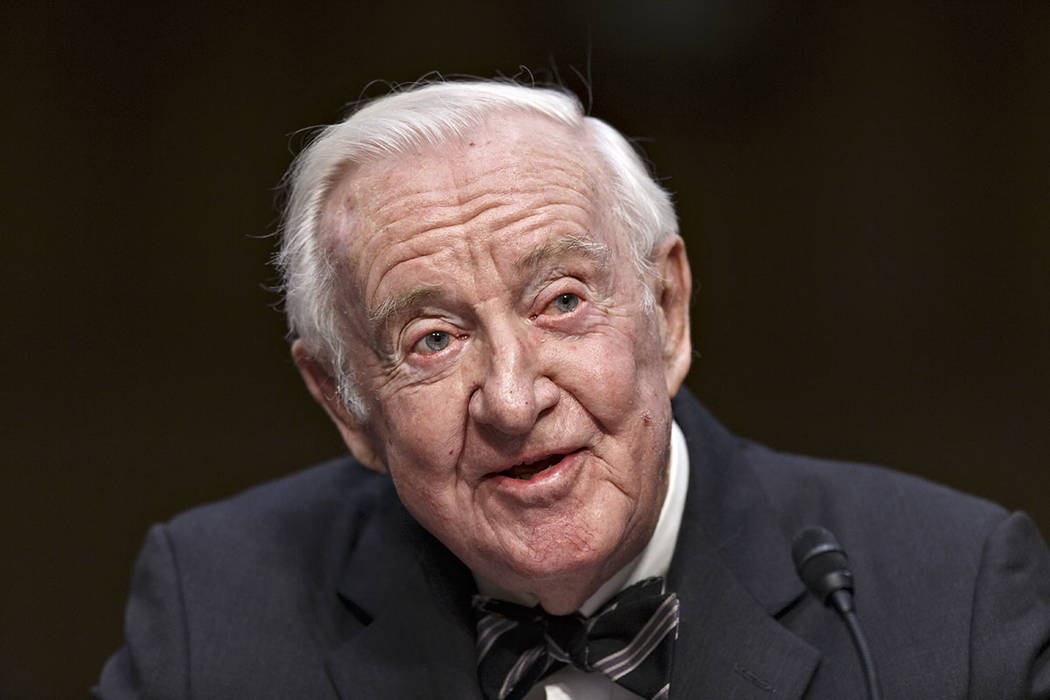 FILE - In this April 30, 2014, file photo, retired Supreme Court Justice John Paul Stevens test ...