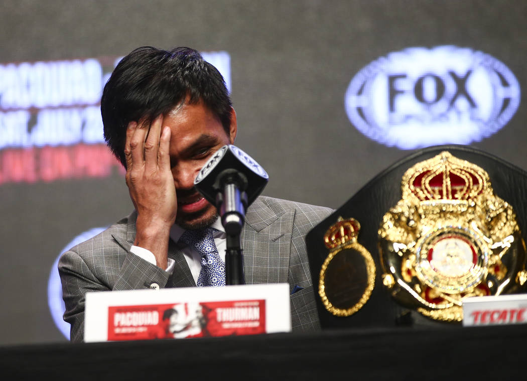 Manny Pacquiao reacts while listening during a press conference ahead of his WBA welterweight c ...