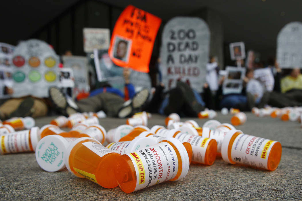 In an April 5, 2019, file photo, containers depicting OxyContin prescription pill bottles lie o ...