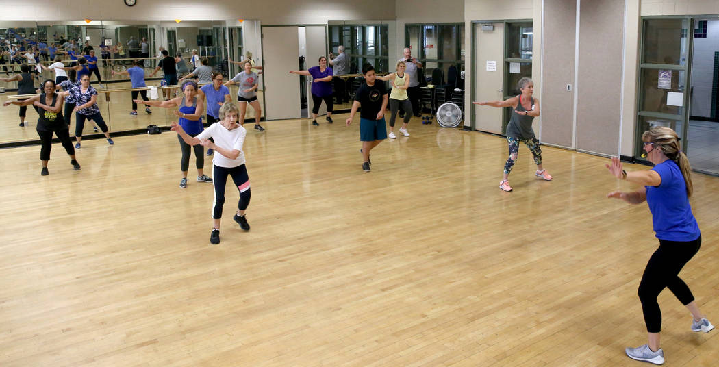 Anita Stephens, right, leads a STRONG by Zumba class as part of the SilverSneakers fitness prog ...