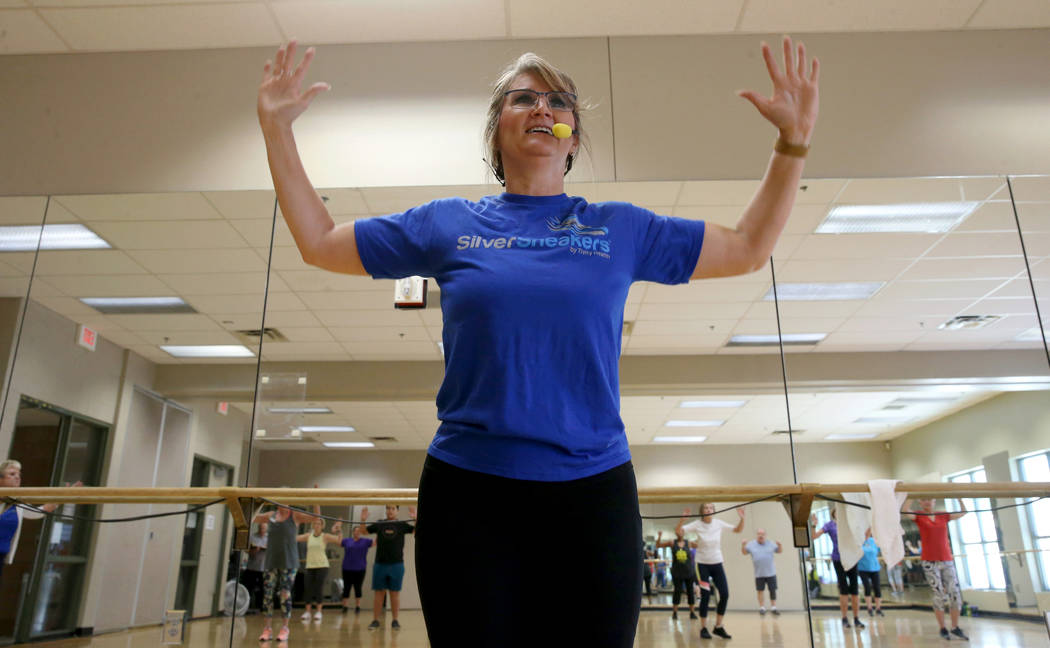 Anita Stephens leads a STRONG by Zumba class as part of the SilverSneakers fitness program at D ...