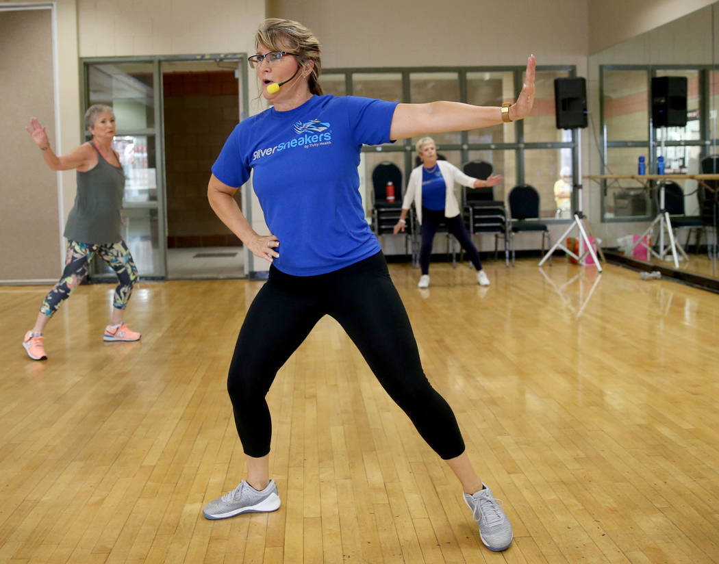 Anita Stephens leads a STRONG by Zumba class as part of the SilverSneakers fitness program at D ...