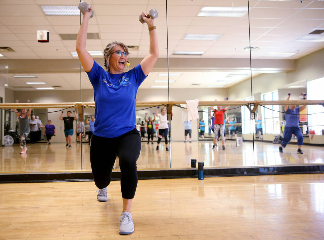 Anita Stephens leads a STRONG by Zumba class as part of the SilverSneakers fitness program at D ...