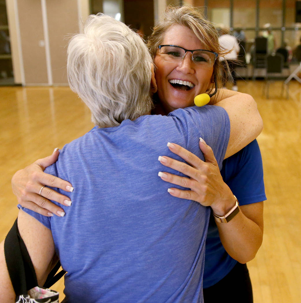 Anita Stephens, right, hugs Cindy Polito after STRONG by Zumba class as part of the SilverSneak ...