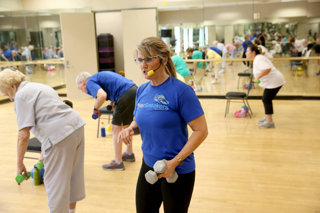 Anita Stephens teaches a Body Flow class as part of the SilverSneakers fitness program at Duran ...