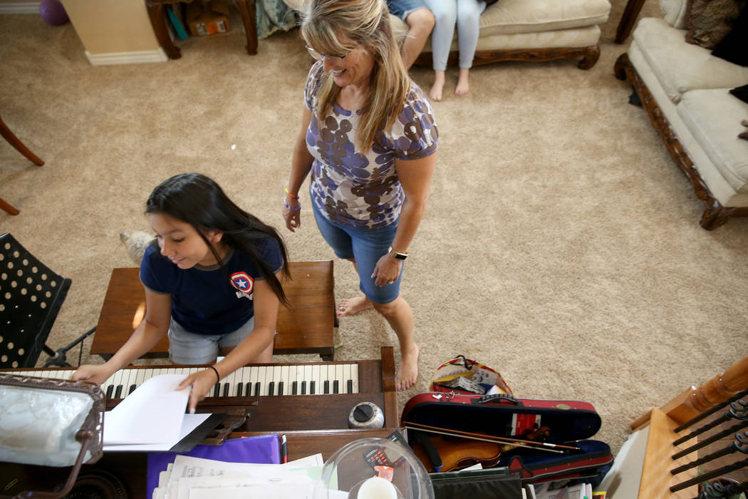 Anita Stephens, right, hangs out with adopted daughter Serra Stephens, 14, at their Las Vegas h ...