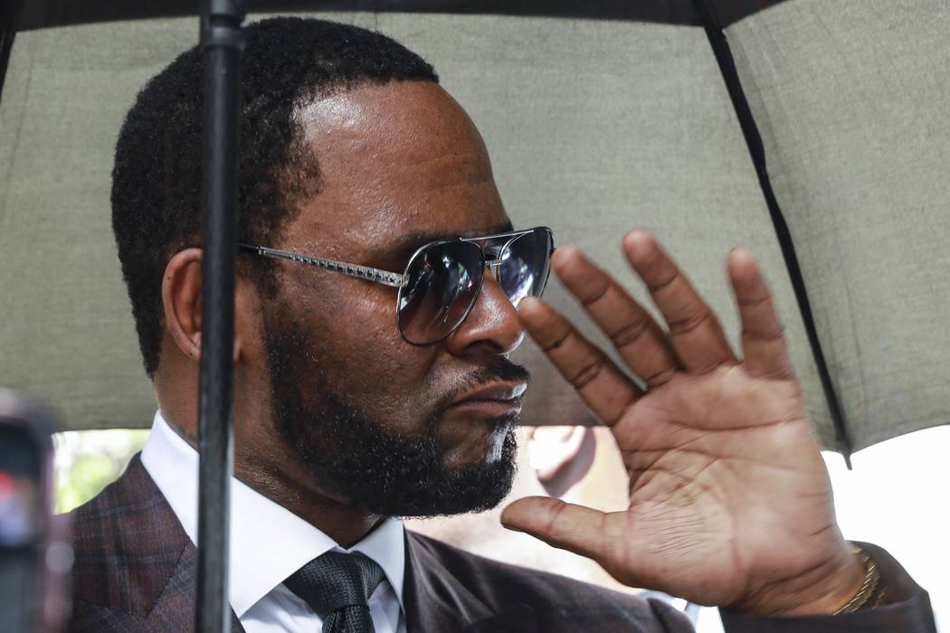 In a June 26, 2019, file photo, Musician R. Kelly departs from the Leighton Criminal Court buil ...