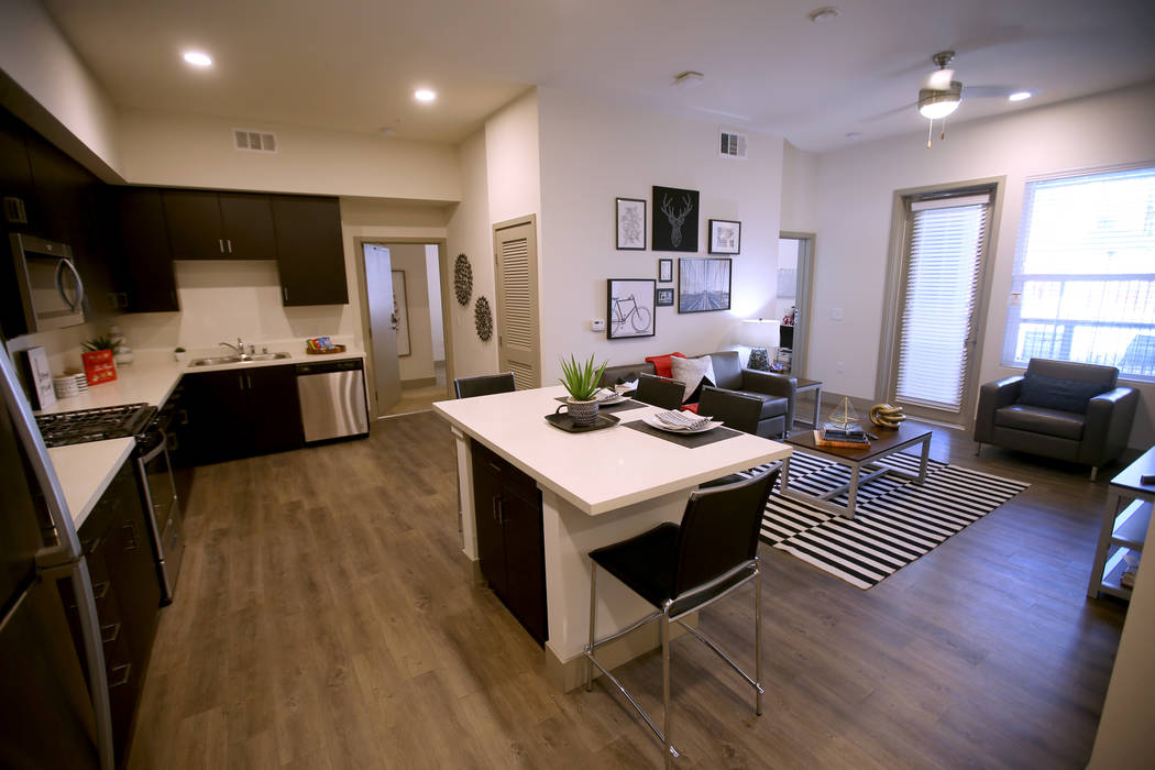 The common living area of a four-bedroom unit at The Degree, a recently-opened 226-unit on-camp ...