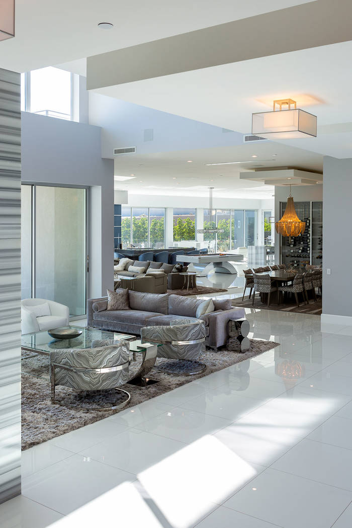 The home has an open floor plan and floor-to-ceiling windows. (Ivan Sher Group)