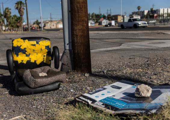 Discarded furniture and empty boxes lay in a field close to the intersection of South Las Vegas ...