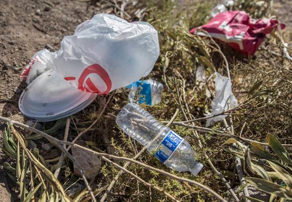 Trash piles up in a field on H Street near West Bonanza Road on Wednesday, July 17, 2019, in La ...