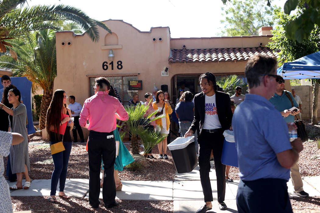 Guests socialize at the new office for Kamala Harris' 2020 presidential campaign in Las Vegas, ...