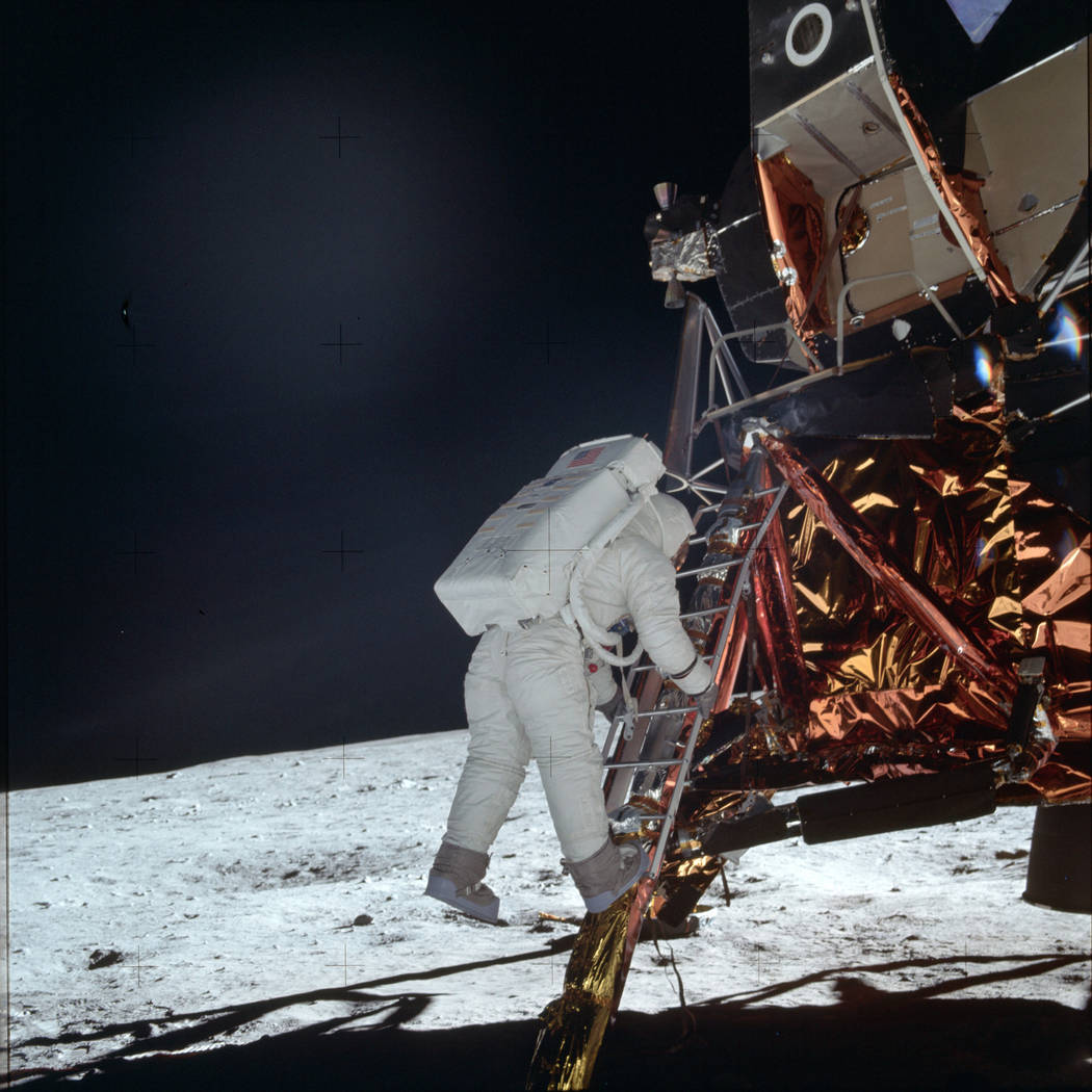 In this July 20, 1969 photo made available by NASA, astronaut Buzz Aldrin Jr. descends a ladder ...