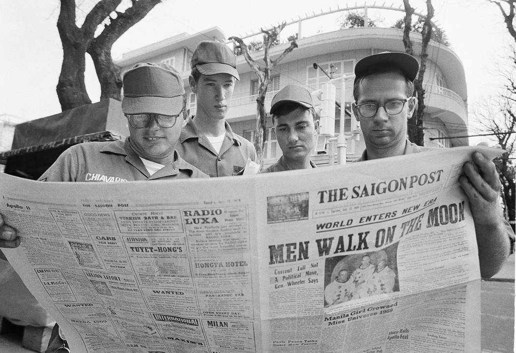 In this July 21, 1969 file photo, U.S. Air Force Sgt. Michael Chivaris, Clinton, Mass.; Army Sp ...