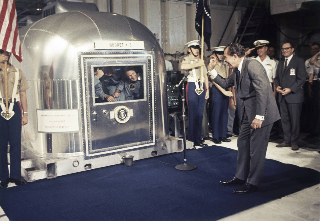 In this July 24, 1969 file photo, President Richard Nixon gives an "OK" sign as he gr ...