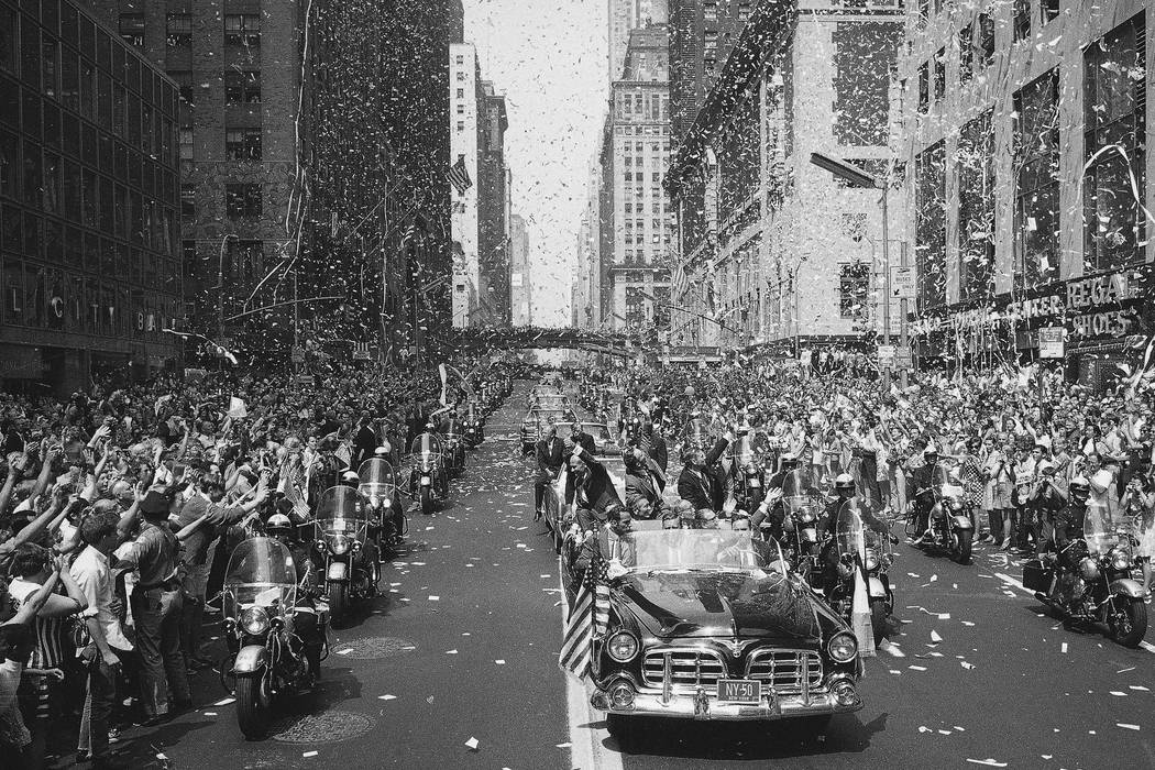 In this Aug. 13, 1969 file photo, people line 42nd Street in New York to cheer Apollo 11 astron ...