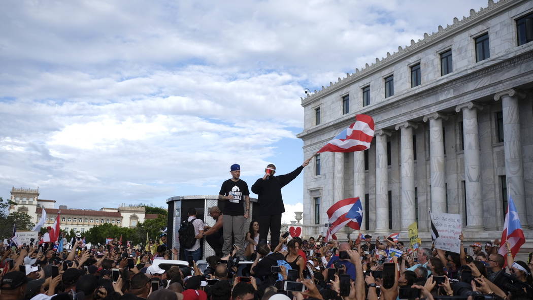 Puerto Rican rapper Rene Juan Perez known by his stage name Residente and Benito Antonio Martin ...