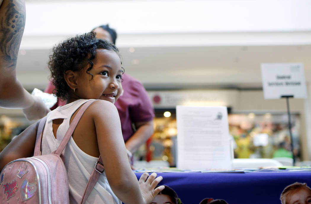 London Richey, 6, going into the first grade, attends the annual Cox Back to School Fair at the ...