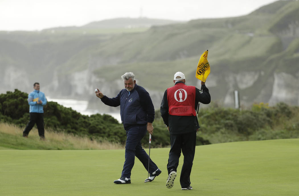 Northern Ireland's Darren Clarke acknowledges the crowd after getting a birdie on the 5th green ...