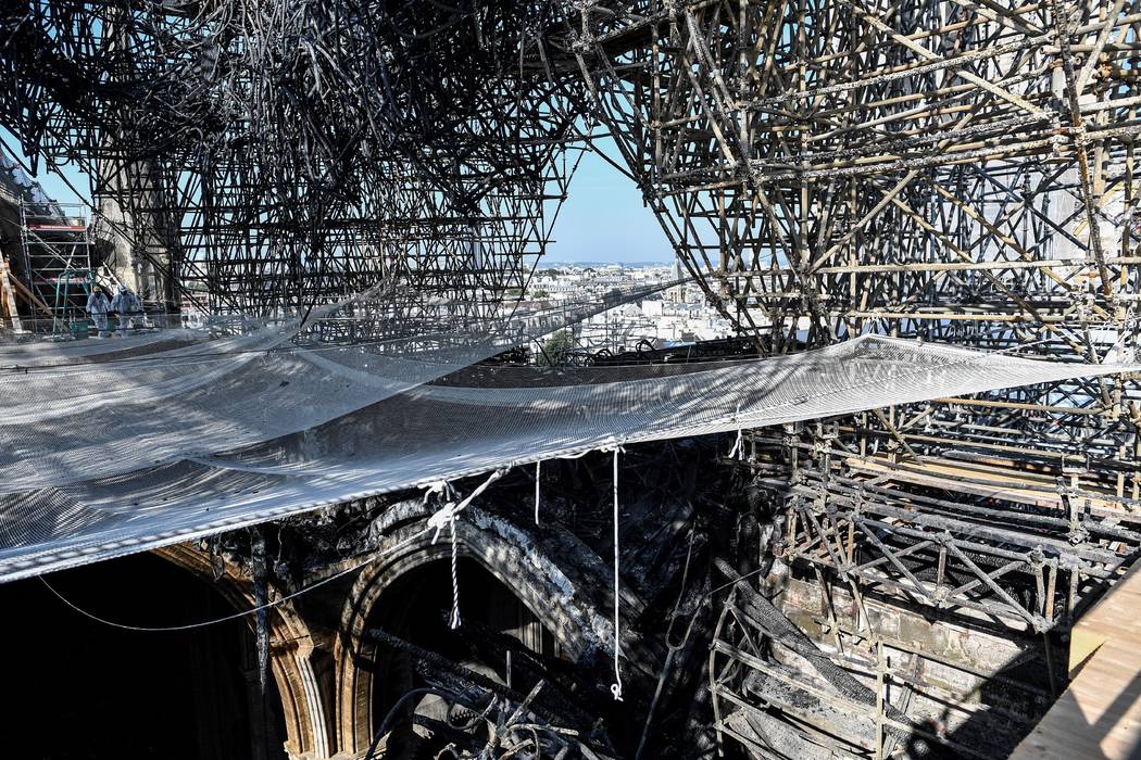 Parts of a destroyed ribbed vault and scaffolding are pictured at the Notre-Dame de Paris Cathe ...