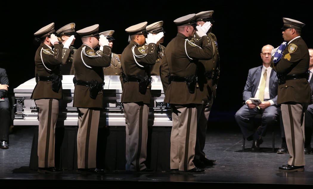 Las Vegas police honor guard prepare the flag during funeral services for former Metropolitan P ...