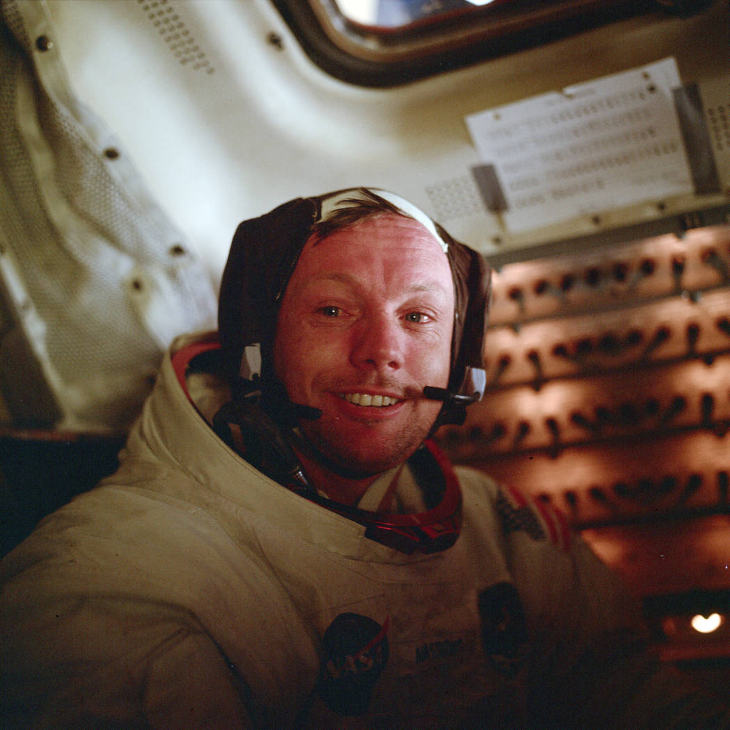 Astronaut Neil Armstrong, Apollo 11 commander, sits inside the Lunar Module after he and Buzz A ...