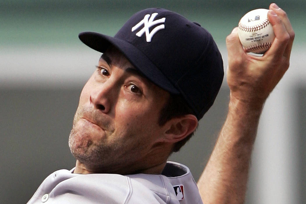 New York Yankees starting pitcher Mike Mussina delivers to the Boston Red Sox during the first ...