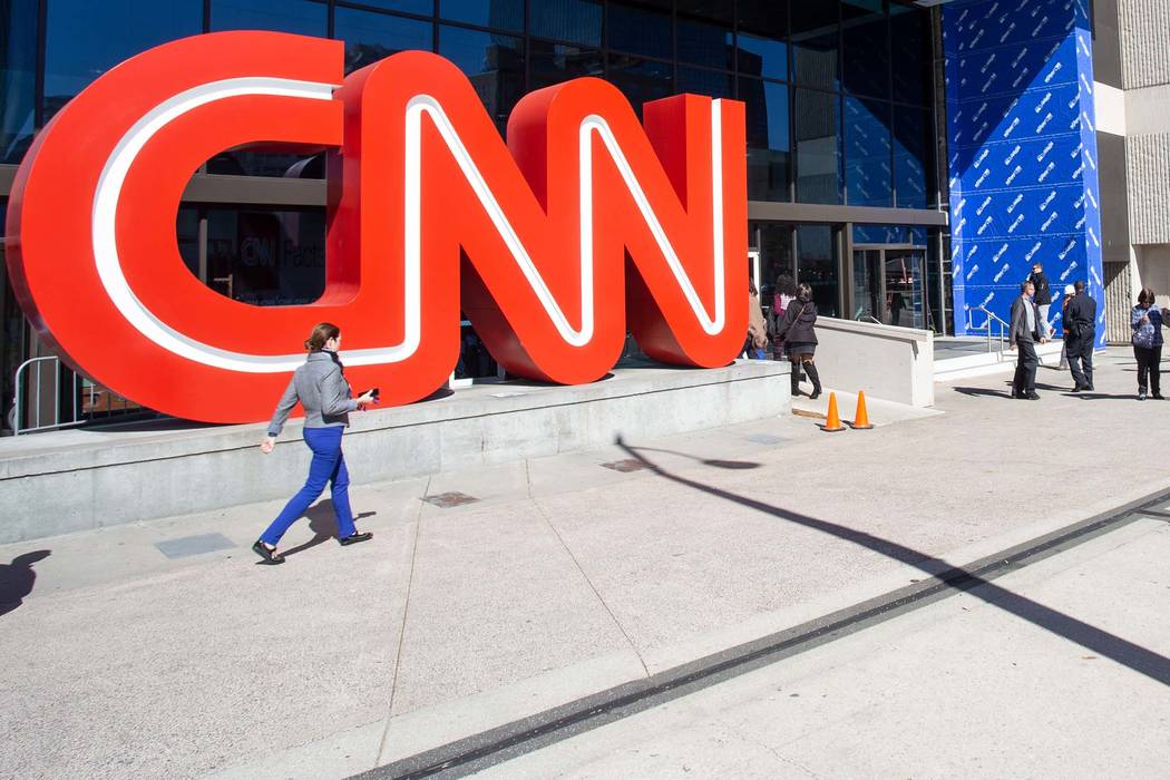 People walk outside CNN Center in 2018 in Atlanta. (AP Photo/Ron Harris)