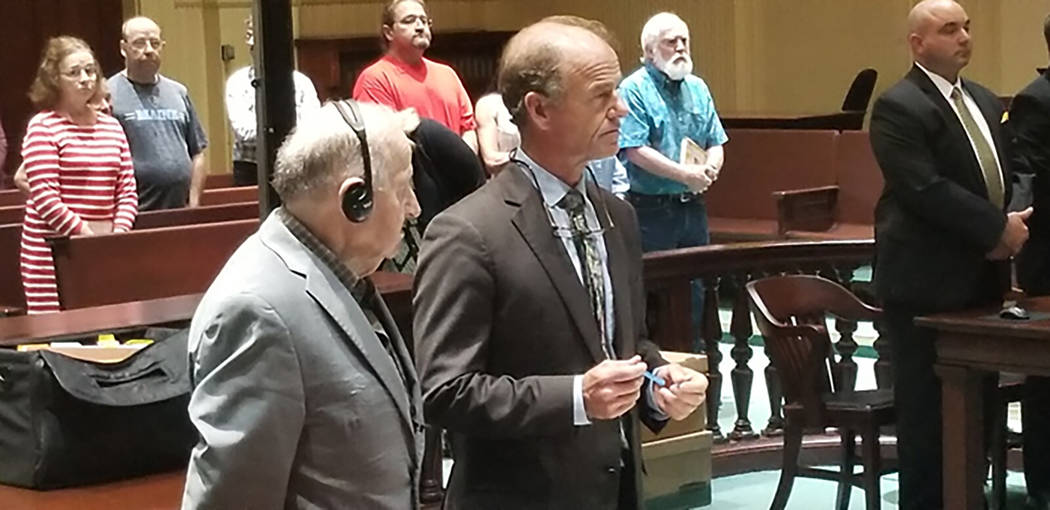 Albert Flick, left, stands beside his defense attorney, Allan Lobozzo, as the jury delivers a g ...